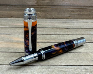 Large rollerball pen with orange, black, and purple epoxy